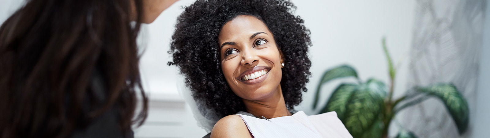 woman smiling with her dentist