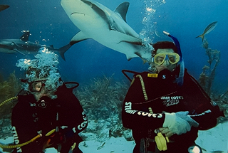 Dr. Pedraza swimming with sharks